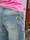 Alaia low-waisted jeans with lightning detail - Light denim